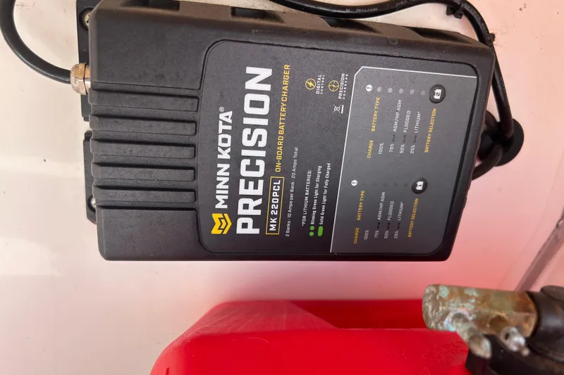 Slide: The Image of Minn Kota Precision MK 220PCL onboard battery charger in Mako Pro Skiff 19 CC, 2021 model. - 22
