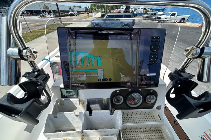 Slide: The Image of 2021 Mako Pro Skiff 19 CC dashboard with Humminbird navigation display. - 9