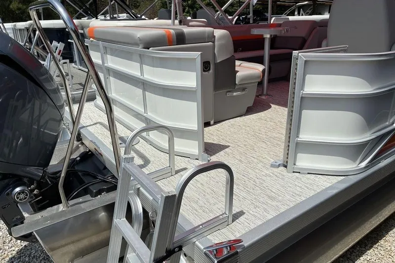Slide: The Image of 2025 Bennington SX L-Bench 22 SXL pontoon boat with open gate and seating area. - 7