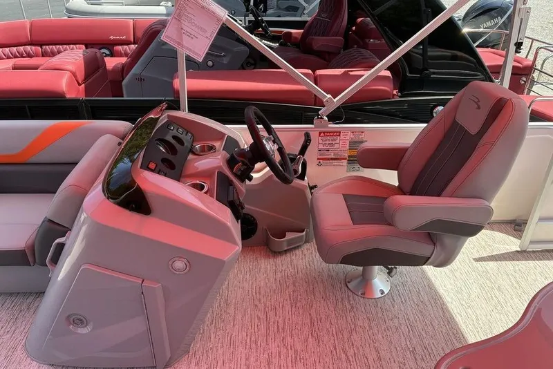 Slide: The Image of 2025 Bennington SX L-Bench 22 SXL boat interior with steering console and seating. - 8