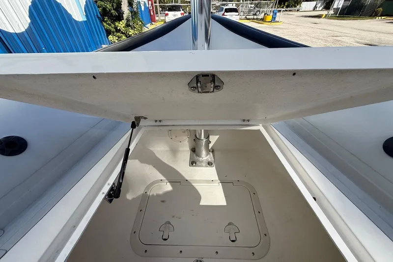 Slide: The Image of Open storage compartment on a 2018 Ribcraft 7.8 boat, showing interior details. - 10