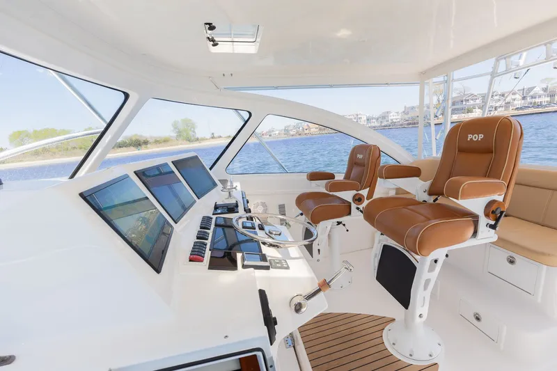 Slide: The Image of Interior of 2022 Albemarle 36 Express with modern helm console. - 12
