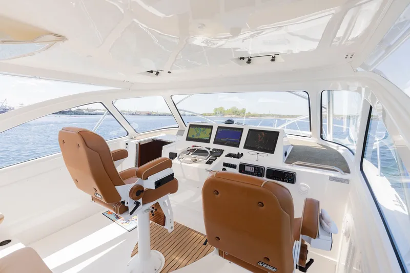 Slide: The Image of Interior of 2022 Albemarle 36 Express with modern helm console. - 13