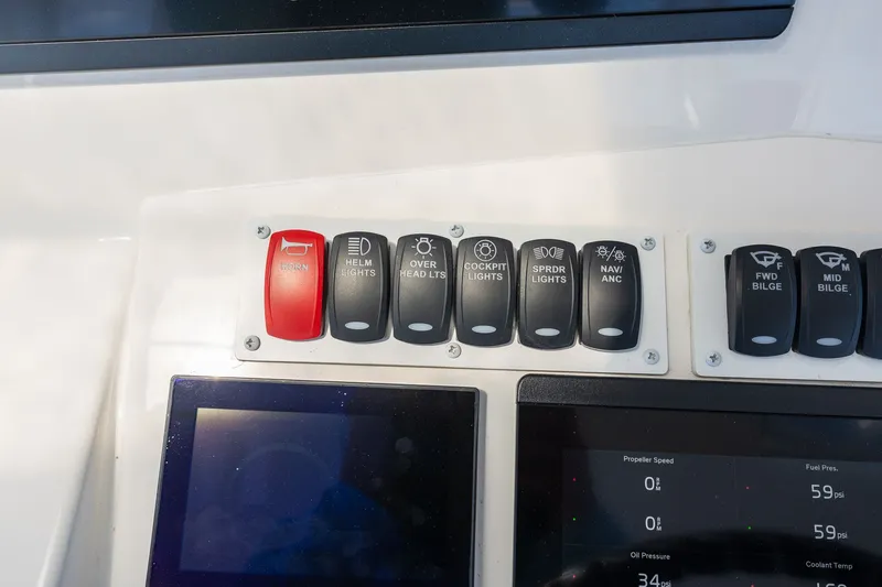 Slide: The Image of Control panel of 2022 Albemarle 36 Express with various switches. - 17