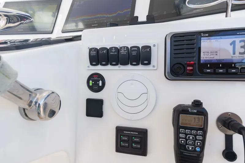 Slide: The Image of Albemarle 36 Express 2022 helm with controls and displays. - 19