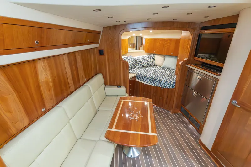 Slide: The Image of Interior of 2022 Albemarle 36 Express with wooden furnishings and cozy seating area. - 31