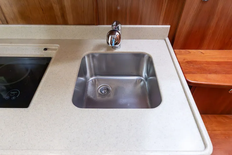 Slide: The Image of Albemarle 36 Express 2022 kitchen area with sink and stove. - 34