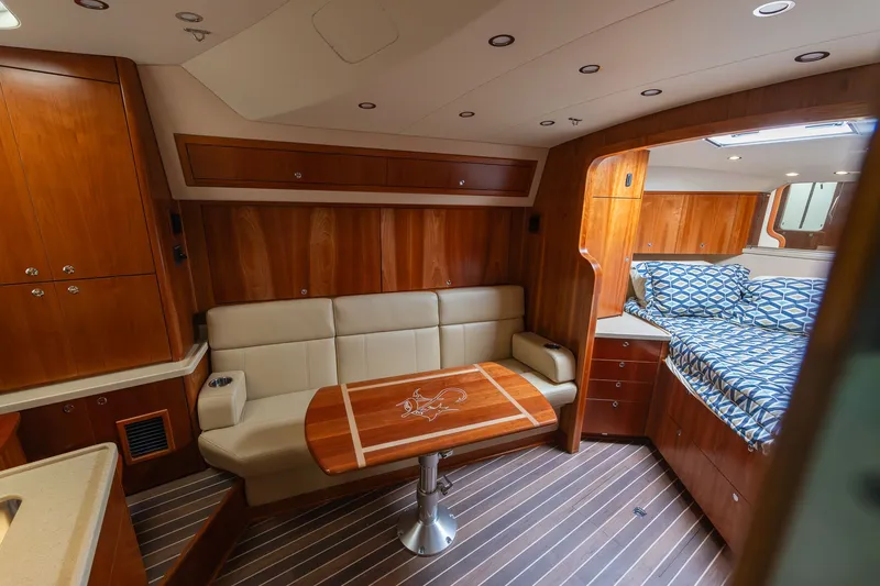 Slide: The Image of Interior of 2022 Albemarle 36 Express with wood furnishings and cozy seating area. - 39