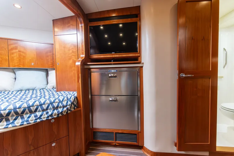 Slide: The Image of Interior of 2022 Albemarle 36 Express with bed, TV, and cabinets. - 41