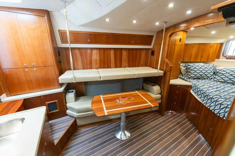 Slide: The Image of Interior of 2022 Albemarle 36 Express with wood furnishings and upholstery. - 43