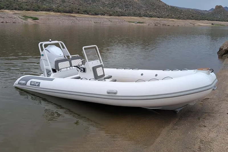 The Image of Manufacturer Provided Image: 2025 Tide Craft Kodiak 16 inflatable boat on a calm lake shore. - 0