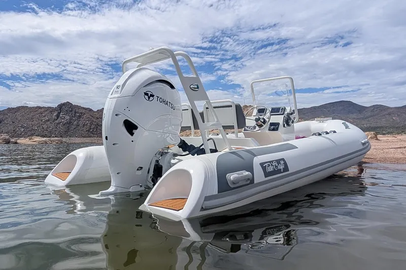 Slide: The Image of Manufacturer Provided Image: 2025 Tide Craft Kodiak 16 boat with Tohatsu engine on calm water, scenic mountain backdrop. - 3