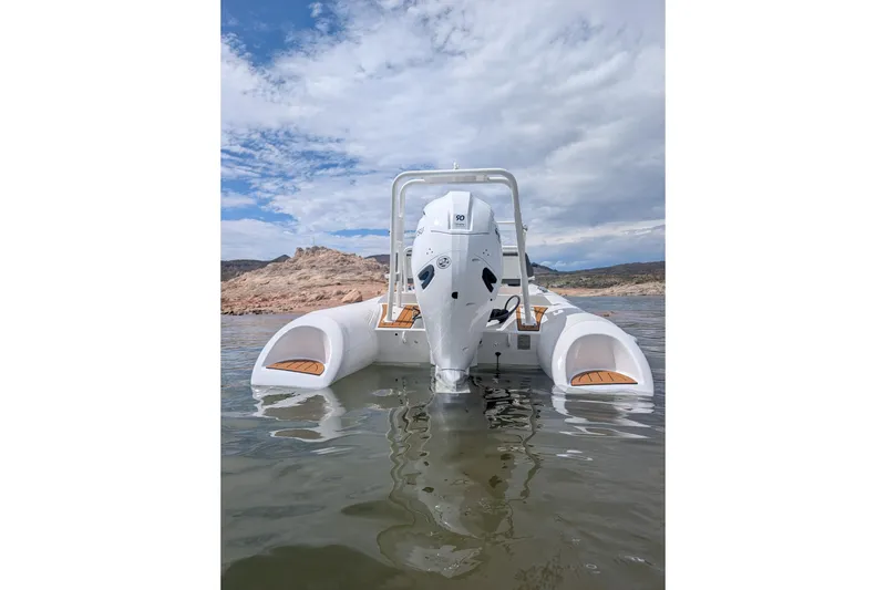 Slide: The Image of 2026 Tide Craft Kodiak 16 boat with outboard motor on calm water. - 6