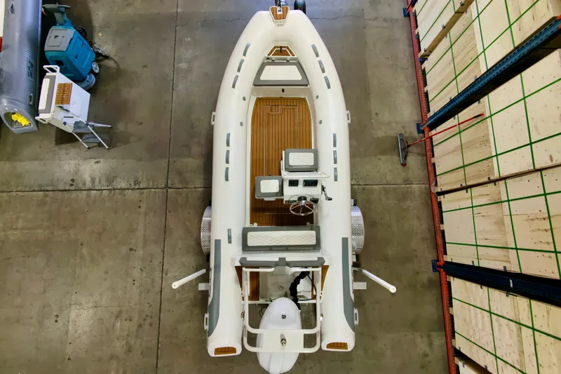 Slide: The Image of Overhead view of 2026 Tide Craft Kodiak 16 boat in warehouse setting. - 7