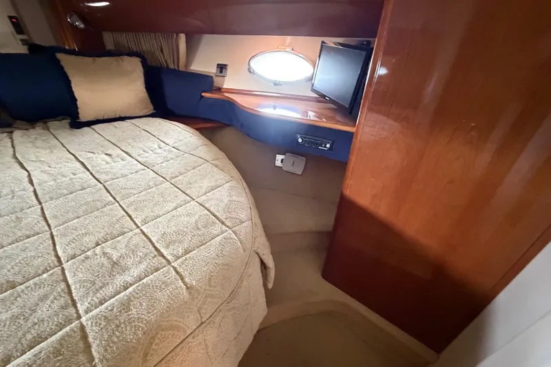 Slide: The Image of Cozy cabin interior of 2003 Viking Princess V50 yacht with bed and porthole window. - 10