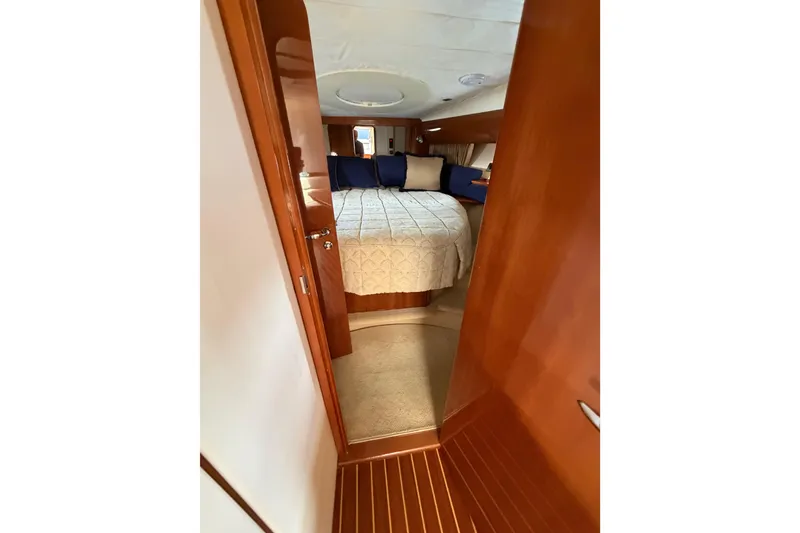 Slide: The Image of Luxurious cabin interior of 2003 Viking Princess V50 yacht with cozy bedding. - 13