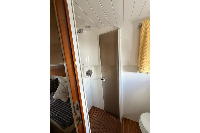 Slide: The Image of Bathroom interior of 2003 Viking Princess V50 yacht with shower and towel. - 14