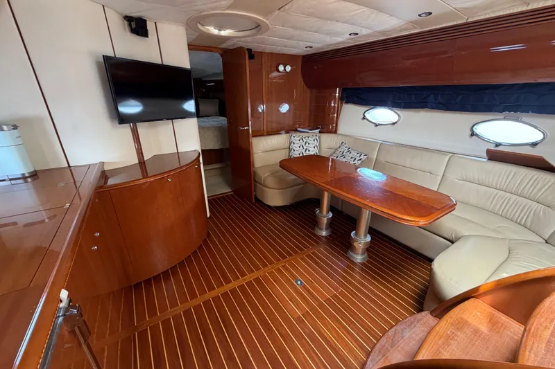 Slide: The Image of Luxurious interior of 2003 Viking Princess V50 yacht with elegant wood finishes and plush seating. - 2