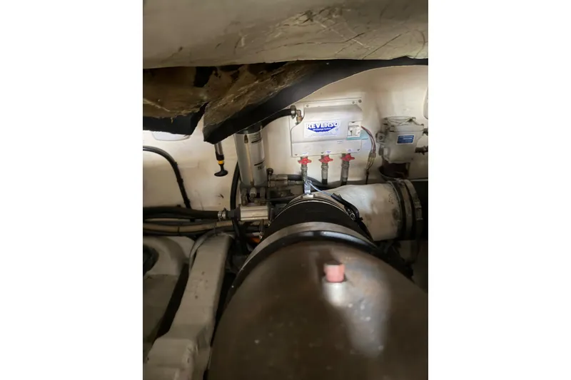 Slide: The Image of Engine room of 2003 Viking Princess V50 yacht with visible Reverso oil change system. - 23