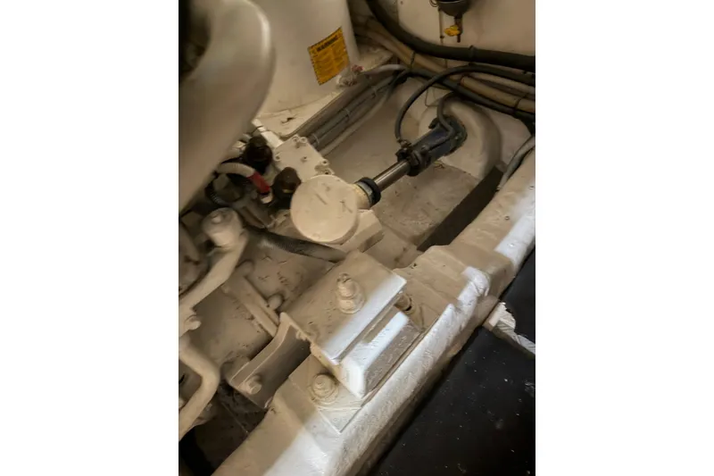 Slide: The Image of Engine compartment of a 2003 Viking Princess V50 yacht, showcasing mechanical components. - 24