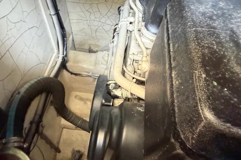 Slide: The Image of Engine compartment of a 2003 Viking Princess V50 yacht, showing hoses and wiring. - 25