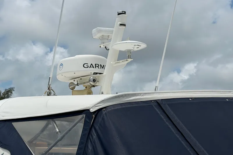 Slide: The Image of Radar equipment on a 2003 Viking Princess V50 yacht under cloudy skies. - 27