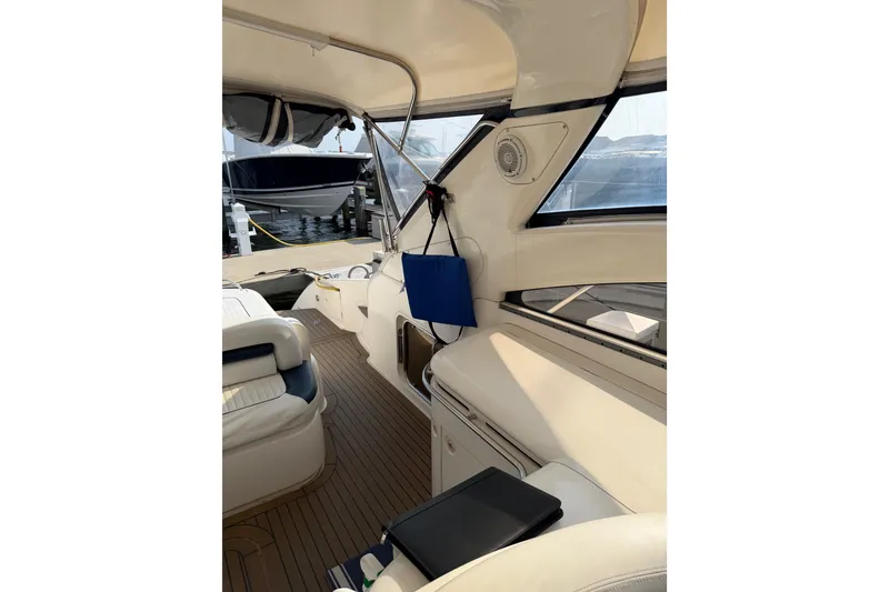 Slide: The Image of Interior view of 2003 Viking Princess V50 yacht with elegant seating and wood flooring. - 29