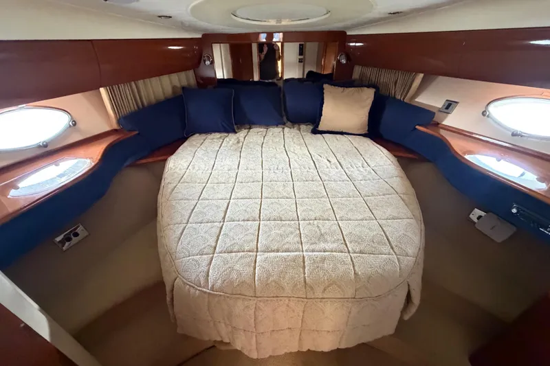 Slide: The Image of Luxurious cabin interior of 2003 Viking Princess V50 yacht with plush bedding. - 3