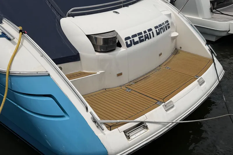 Slide: The Image of 2003 Viking Princess V50 yacht with "Ocean Drive" text on the stern, docked at marina. - 31