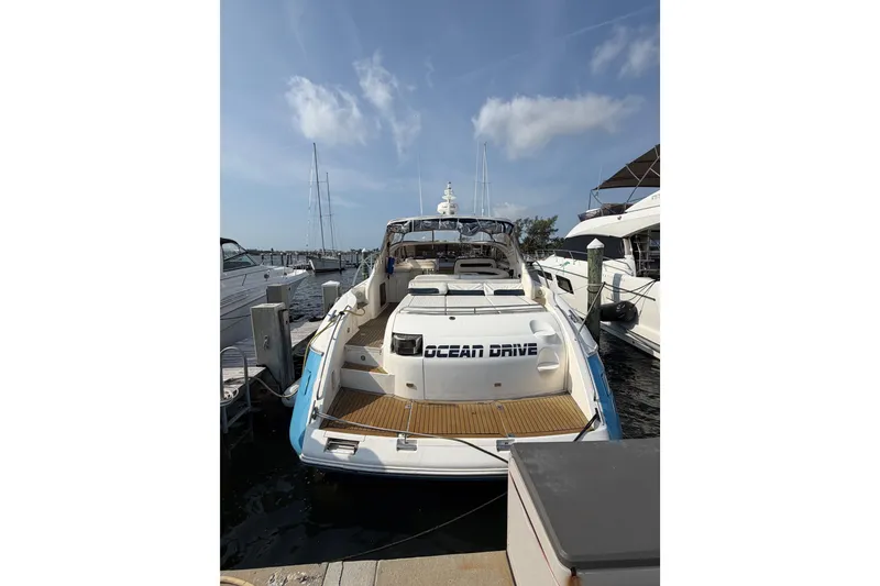 Slide: The Image of 2003 Viking Princess V50 yacht docked at marina under clear sky. - 32