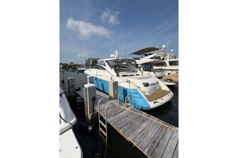 Slide: The Image of 2003 Viking Princess V50 yacht docked at marina under clear blue sky. - 33