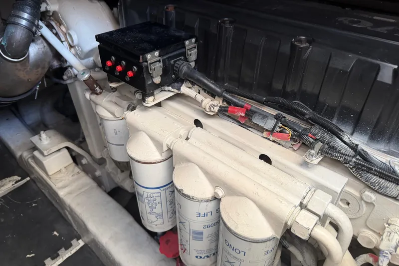 Slide: The Image of Engine compartment of a 2003 Viking Princess V50 yacht, showing filters and wiring. - 5