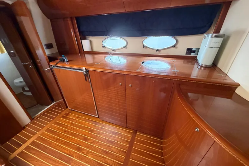 Slide: The Image of Luxurious interior of 2003 Viking Princess V50 yacht with polished wood cabinetry. - 7