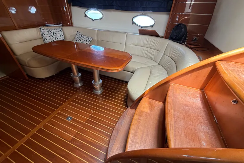 Slide: The Image of Luxurious interior of 2003 Viking Princess V50 yacht with wooden flooring and plush seating. - 9