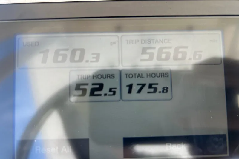 Slide: The Image of Display screen showing fuel usage, trip distance, and hours for 2021 Sea Hunt Ultra 234. - 17