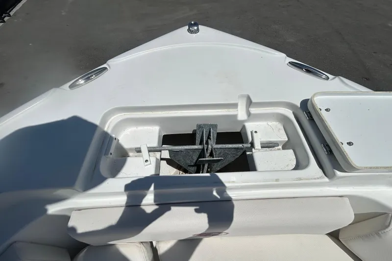Slide: The Image of Anchor storage compartment on a 2021 Sea Hunt Ultra 234 boat. - 25
