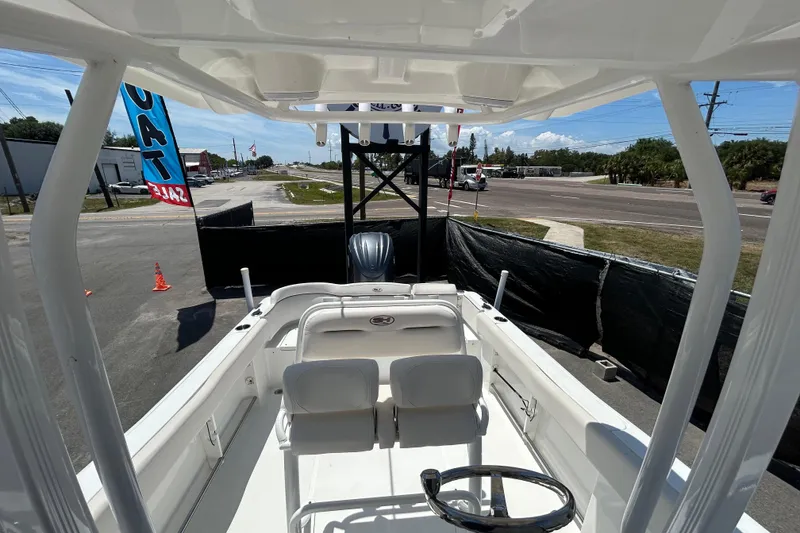 Slide: The Image of 2021 Sea Hunt Ultra 234 boat interior view at a sales lot. - 34