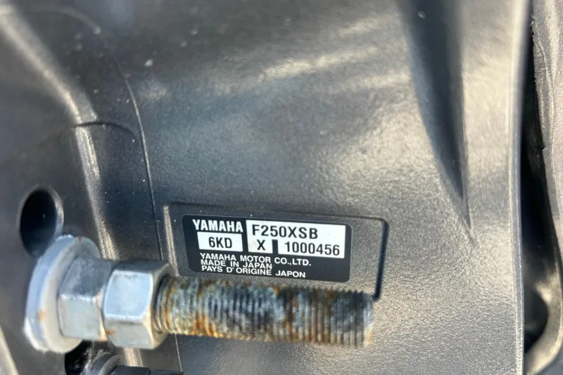 Slide: The Image of Yamaha F250XSB engine label on 2021 Sea Hunt Ultra 234 boat, showing model details. - 42