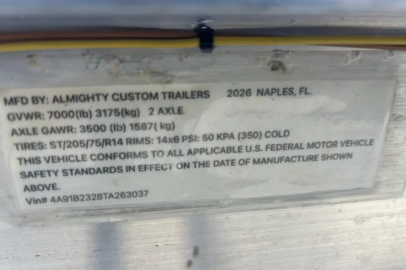 Slide: The Image of Label on trailer by Almighty Custom Trailers, detailing specifications and compliance standards. - 44