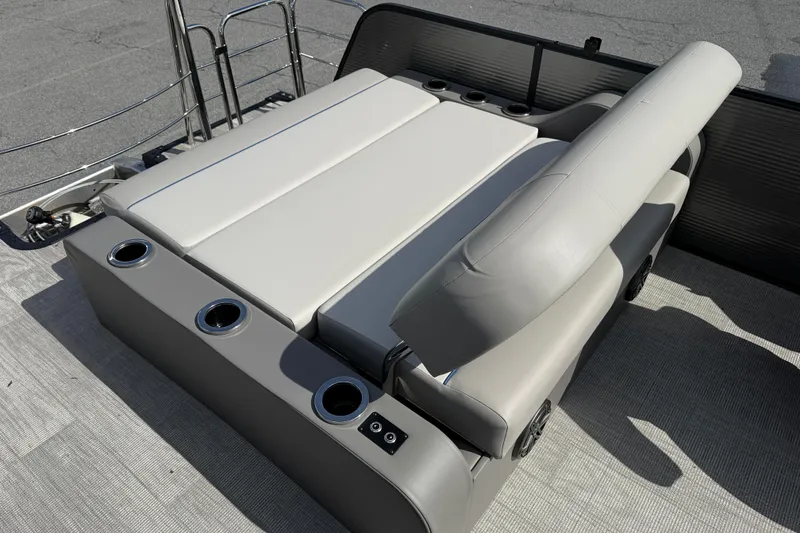 Slide: The Image of 2025 Qwest SplashPad 22 TriToon seating area with cup holders. - 10