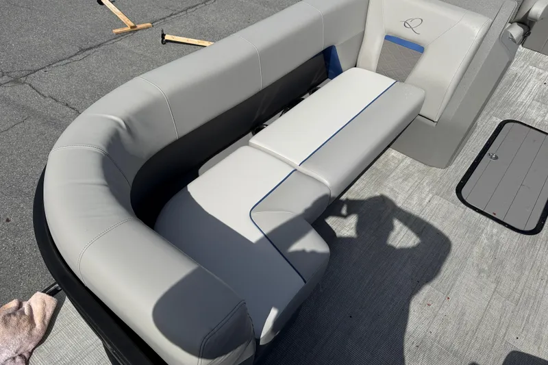 Slide: The Image of Interior of 2025 Qwest SplashPad 22 Performance TriToon with gray upholstery. - 5