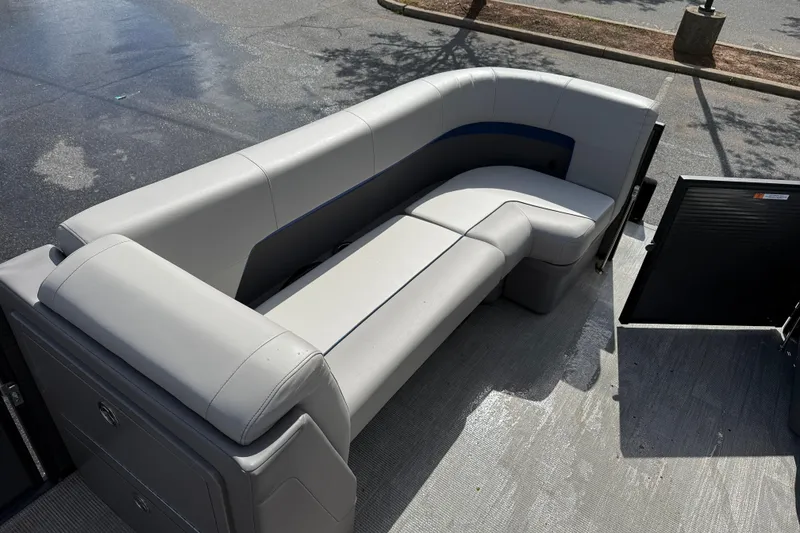Slide: The Image of Interior of Qwest SplashPad 22 TriToon 2025 with gray seating. - 6