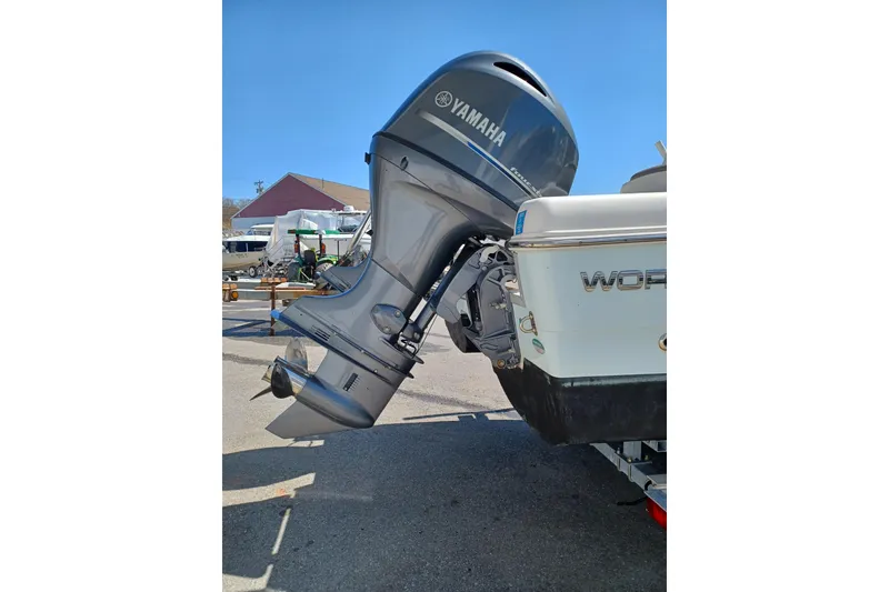 Slide: The Image of Yamaha outboard motor on 2020 World Cat 230 DC boat, parked outdoors. - 22