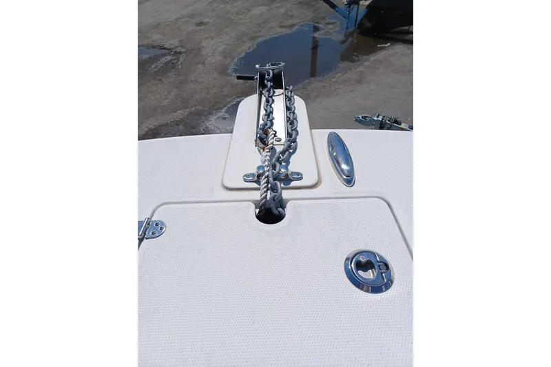 Slide: The Image of Bow of 2020 World Cat 230 DC boat with anchor chain and cleat. - 28