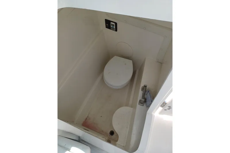 Slide: The Image of 2020 World Cat 230 DC boat interior with compact marine toilet. - 29