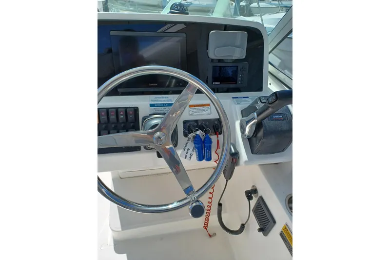 Slide: The Image of Steering console of 2020 World Cat 230 DC boat with navigation equipment. - 30
