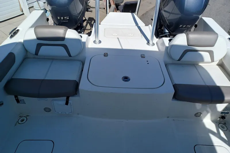 Slide: The Image of 2020 World Cat 230 DC boat interior with dual Yamaha 115 engines. - 32