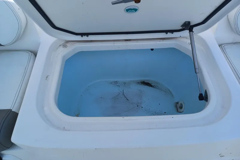 Slide: The Image of Open storage compartment on a 2020 World Cat 230 DC boat. - 33
