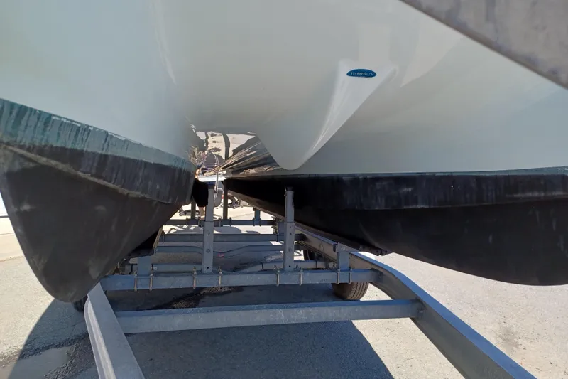Slide: The Image of Underneath view of a 2020 World Cat 230 DC boat on a trailer. - 35