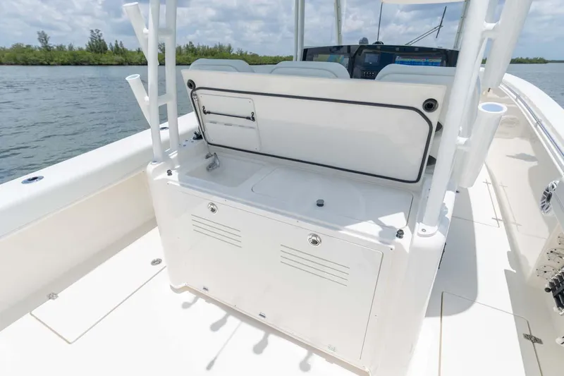 Slide: The Image of Manufacturer Provided Image: 2024 Cobia 350 Center Console boat interior with storage compartments and seating. - 10